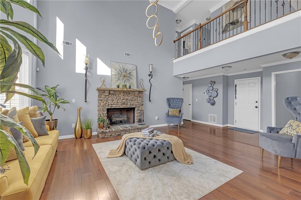 604 Arbor Ridge Loganville, GA 30052 - Photo 13 of 39 a living room with furniture and a fireplace