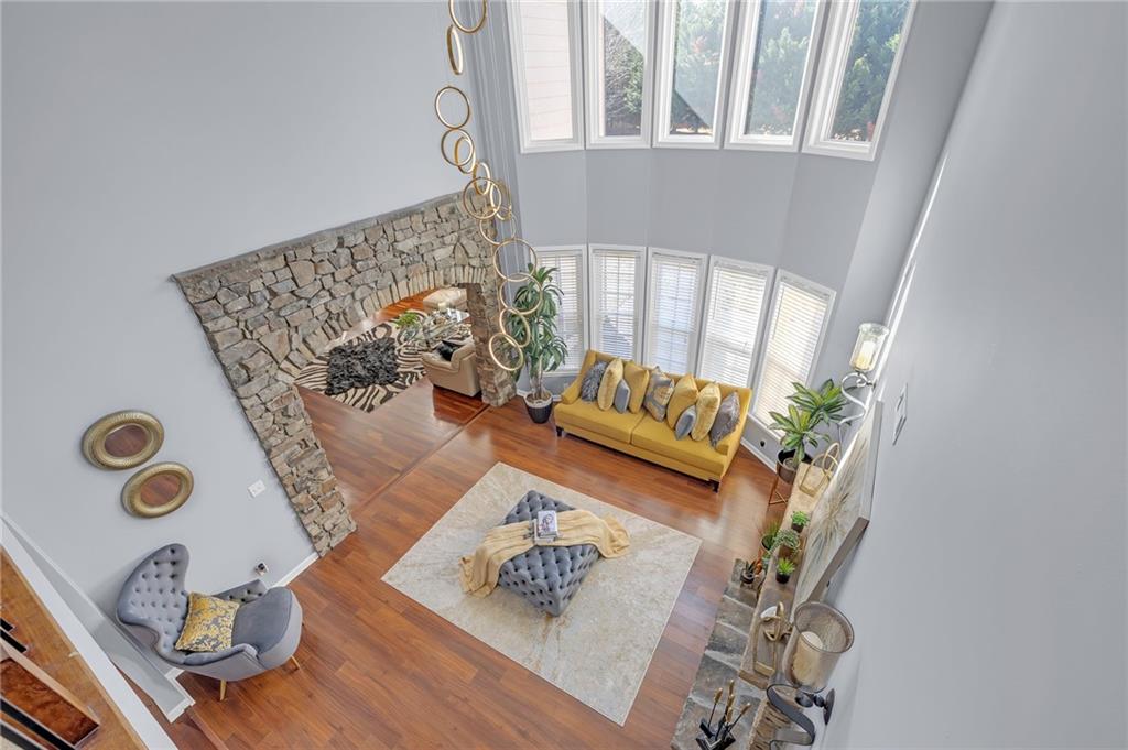604 Arbor Ridge Loganville, GA 30052 - Photo 14 of 39 a living room with furniture and a rug