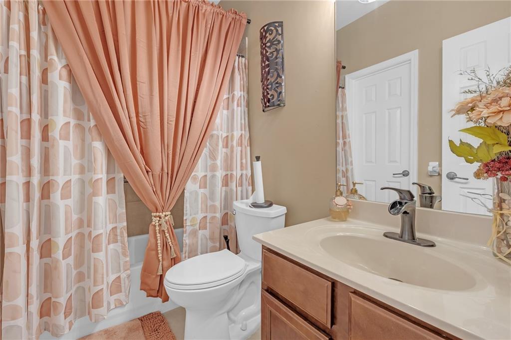 604 Arbor Ridge Loganville, GA 30052 - Photo 15 of 39 a bathroom with a sink toilet and shower
