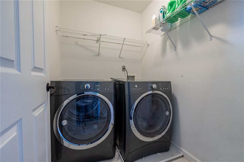 604 Arbor Ridge Loganville, GA 30052 - Photo 32 of 39 a utility room with dryer and washer