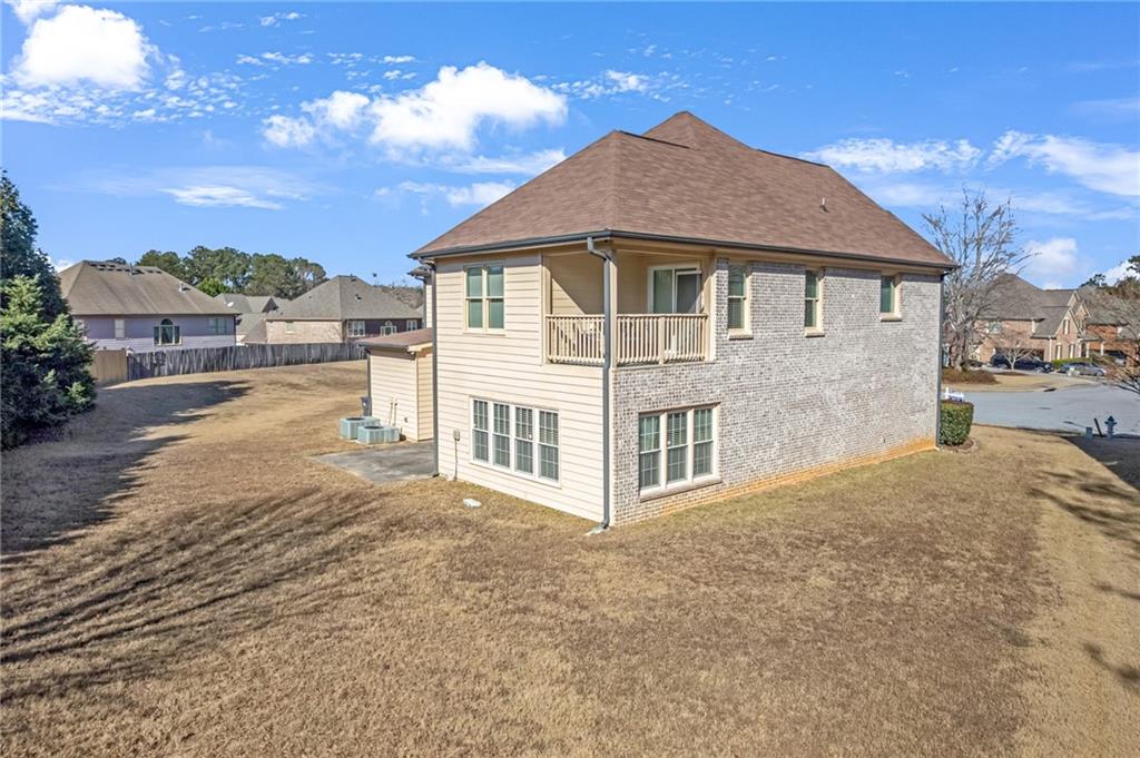 604 Arbor Ridge Loganville, GA 30052 - Photo 34 of 39 a front view of a house with a yard