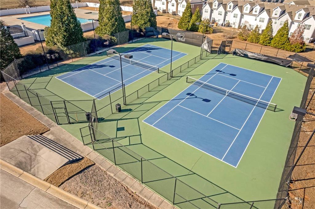 604 Arbor Ridge Loganville, GA 30052 - Photo 39 of 39 a view of a tennis ground with large trees