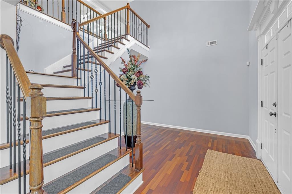 604 Arbor Ridge Loganville, GA 30052 - Photo 4 of 39 a view of entryway with wooden floor