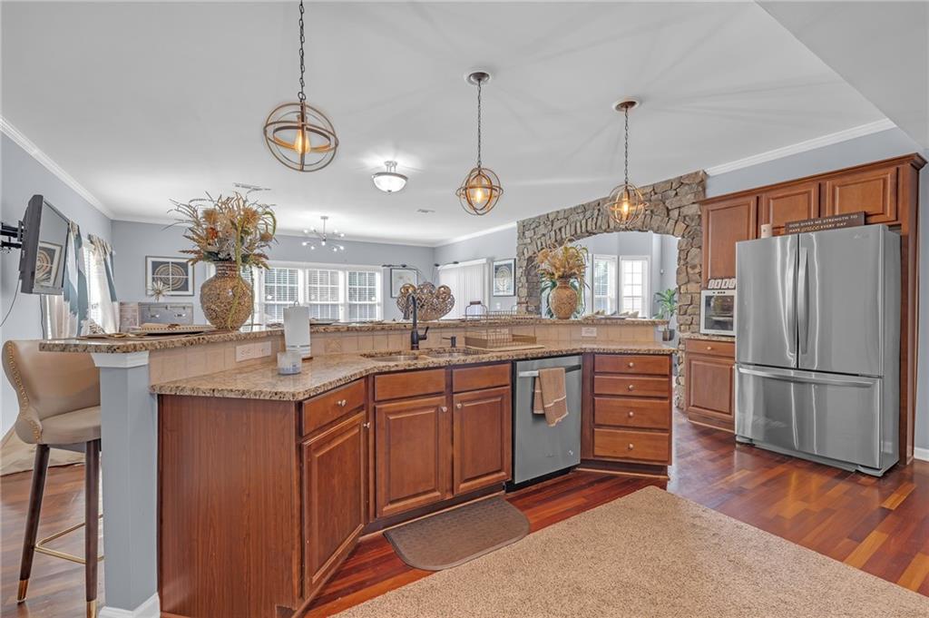 604 Arbor Ridge Loganville, GA 30052 - Photo 10 of 39 a kitchen with sink cabinets and refrigerator