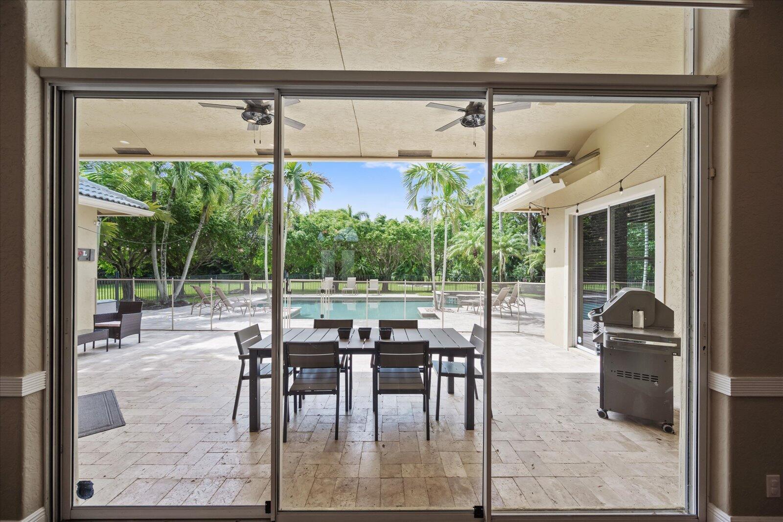 15400 Emmelman Road Wellington, FL 33414 - Photo 31 of 41 Nice deep covered pool patio