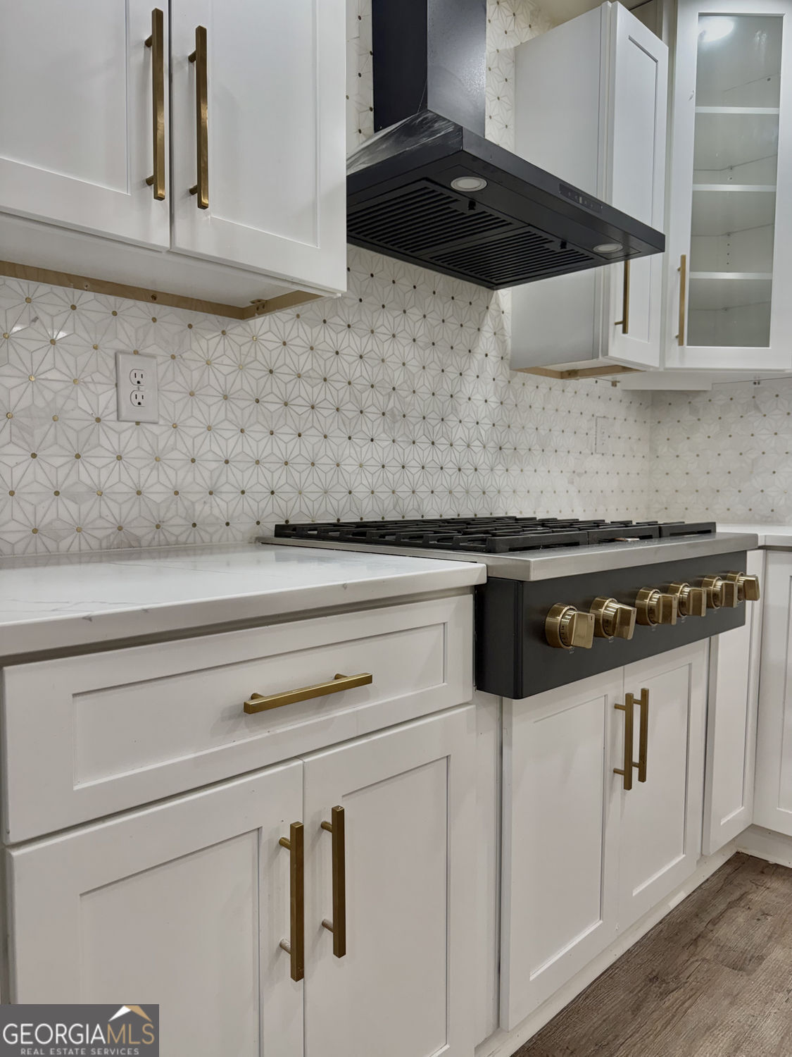 3406 Uncle Genes Way Southeast Conyers, GA 30013 - Photo 7 of 17 a close view of a stove top oven sitting inside of a kitchen