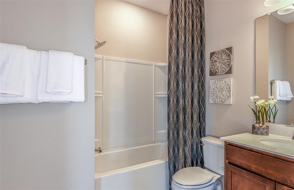 15013 Sunbeam Street Parrish, FL 34219 - Photo 12 of 28 a bathroom with a sink a toilet and shower