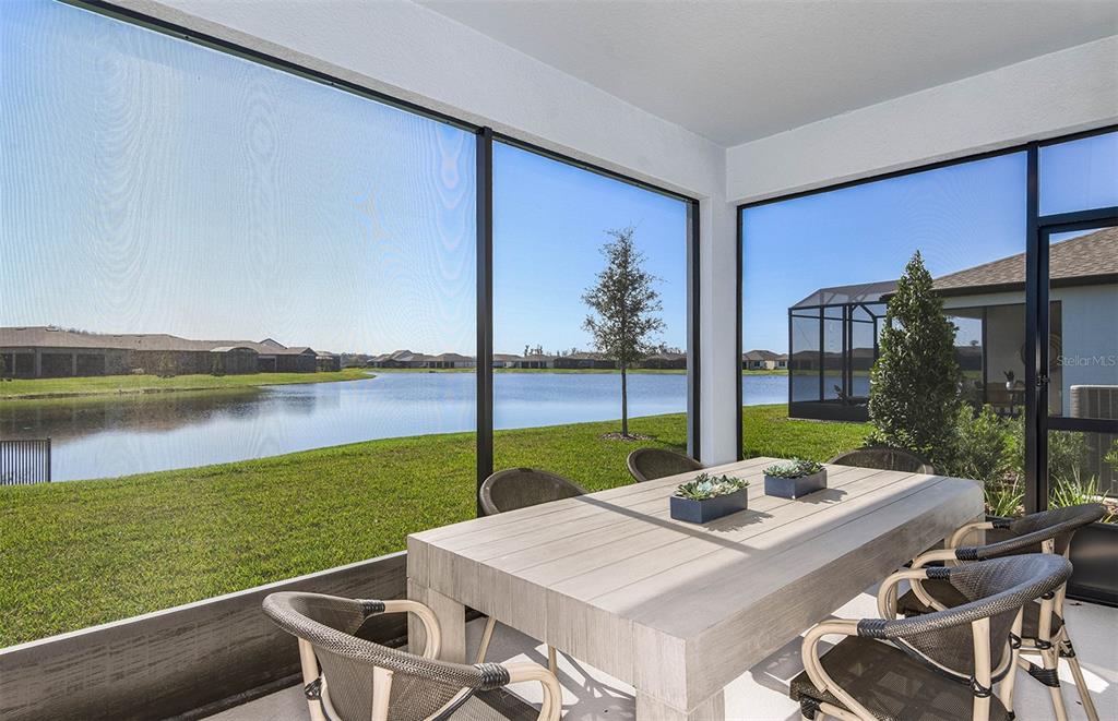 15013 Sunbeam Street Parrish, FL 34219 - Photo 14 of 28 a view of a patio with a table and chairs