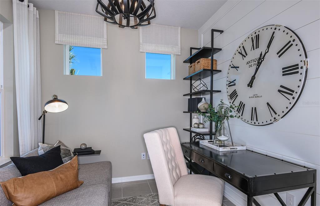 15013 Sunbeam Street Parrish, FL 34219 - Photo 10 of 28 a living room with furniture a rug and a mirror