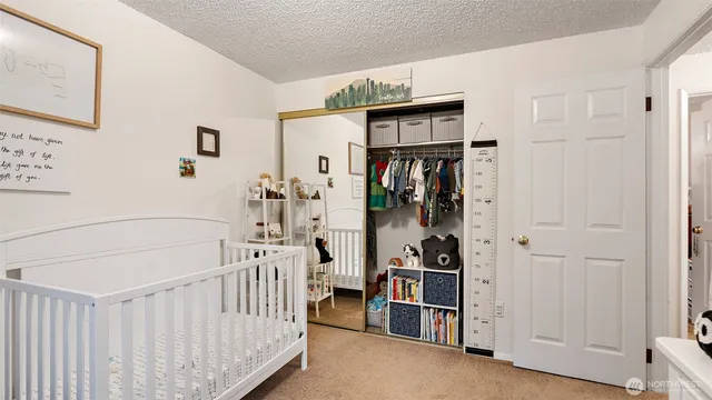 a room that has a bed and a window in it