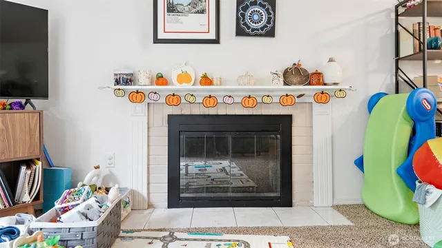 a utility room with painting and a fireplace