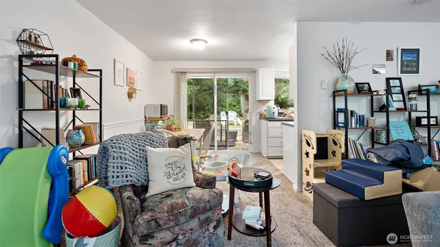 a living room with furniture fireplace and rug