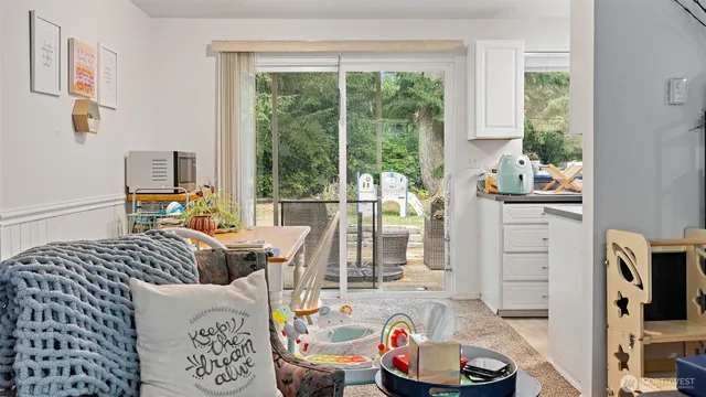 a living room with furniture and a window