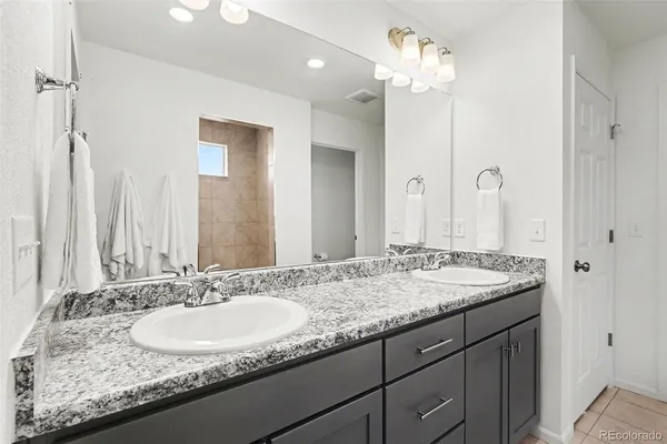 a en suite bathroom with a sink and a shower