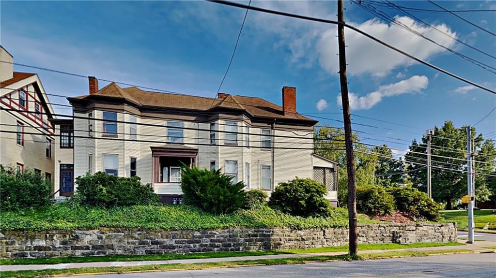 484 Teece Avenue Pittsburgh, PA 15202 - Photo 1 of 25 a front view of a building with garden