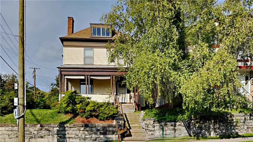 484 Teece Avenue Pittsburgh, PA 15202 - Photo 2 of 25 front view of a house with a small yard