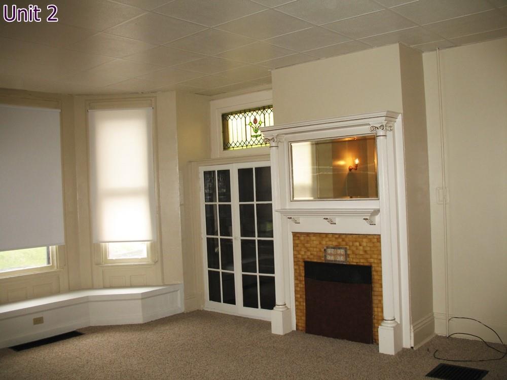 484 Teece Avenue Pittsburgh, PA 15202 - Photo 23 of 25 a view of an empty room with a window and fire place