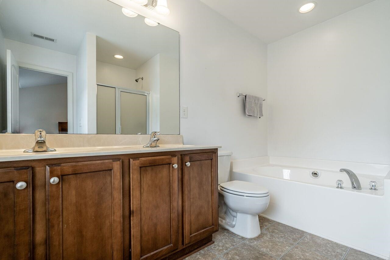 4638 Altha Street Raleigh, NC 27606 - Photo 22 of 27 Ensuite Bath
