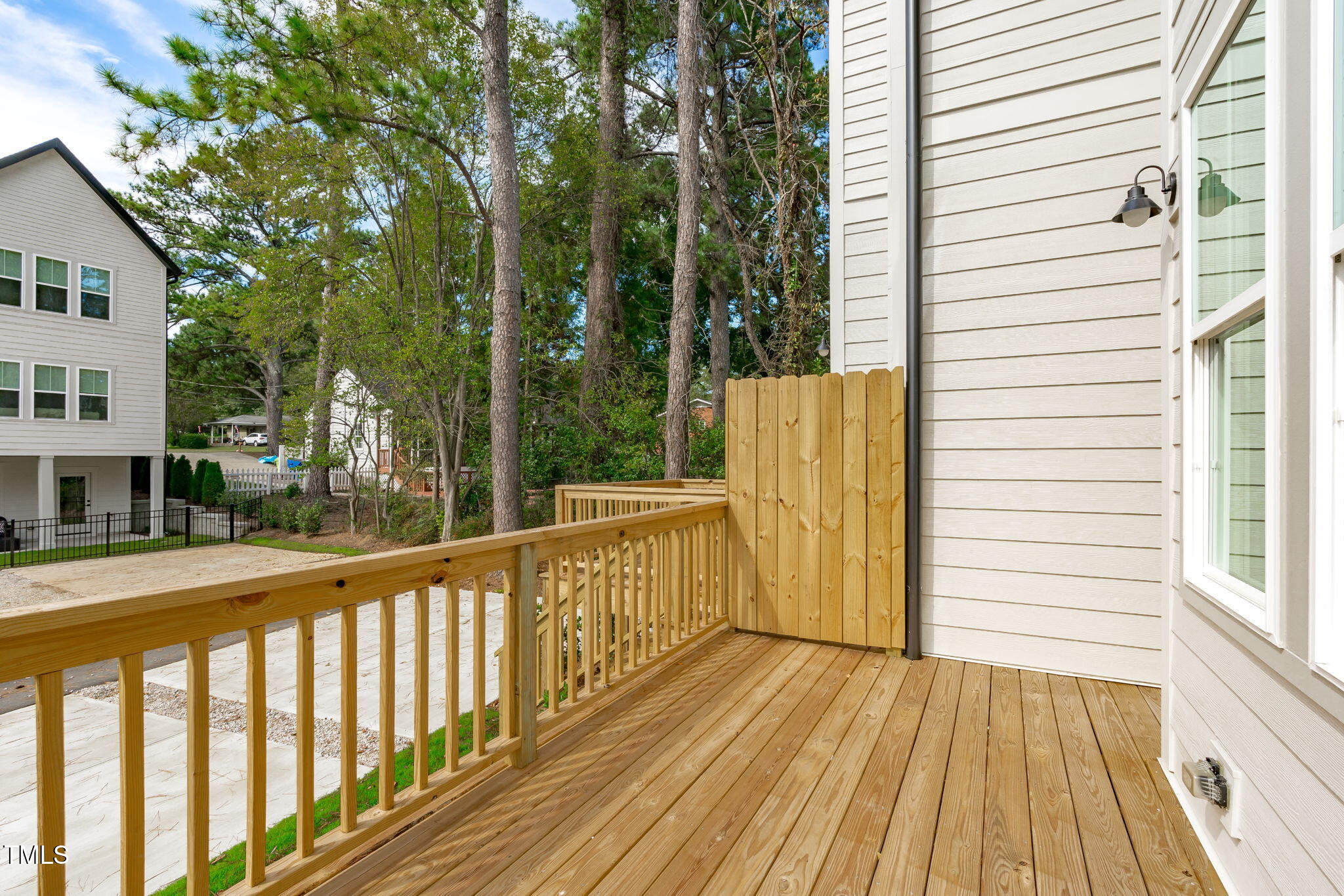 5049 Lundy Drive, Unit 102 Raleigh, NC 27606 - Photo 11 of 48 a view of a balcony with wooden floor