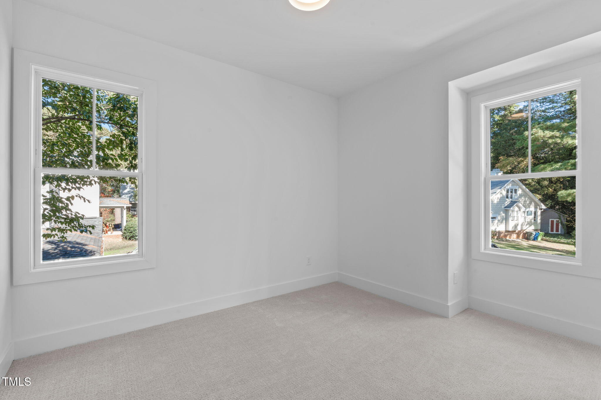 5049 Lundy Drive, Unit 102 Raleigh, NC 27606 - Photo 22 of 48 an empty room with a window