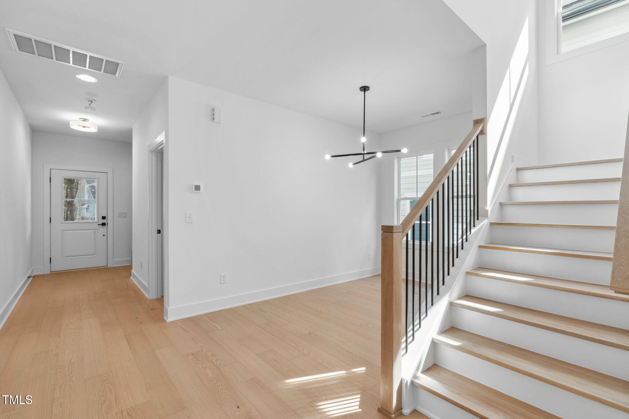 5049 Lundy Drive, Unit 102 Raleigh, NC 27606 - Photo 29 of 48 a view of a hallway view with staircase