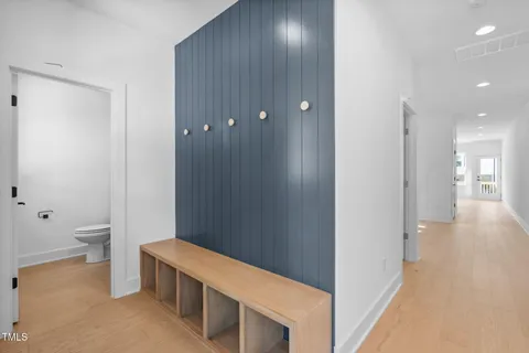 a view of a hallway with bathroom