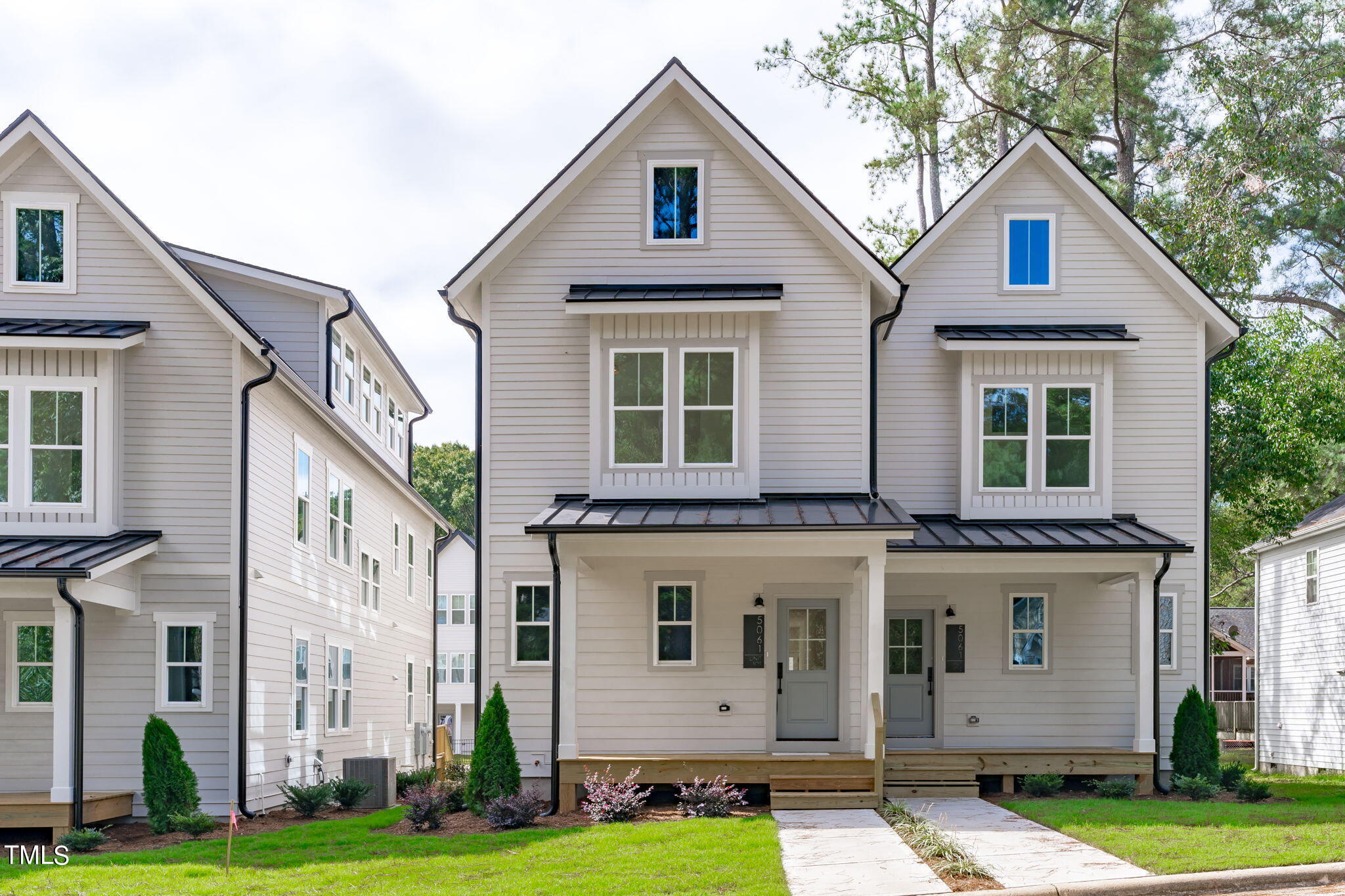5049 Lundy Drive, Unit 102 Raleigh, NC 27606 - Photo 33 of 48 a front view of a house with a yard