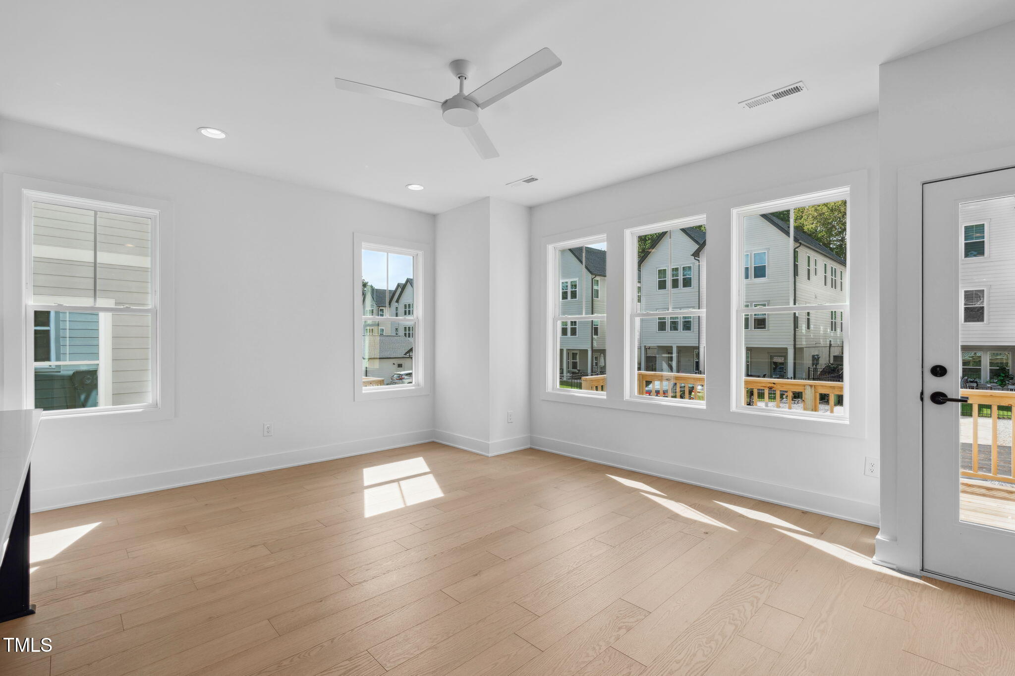 5049 Lundy Drive, Unit 102 Raleigh, NC 27606 - Photo 5 of 48 an empty room with windows