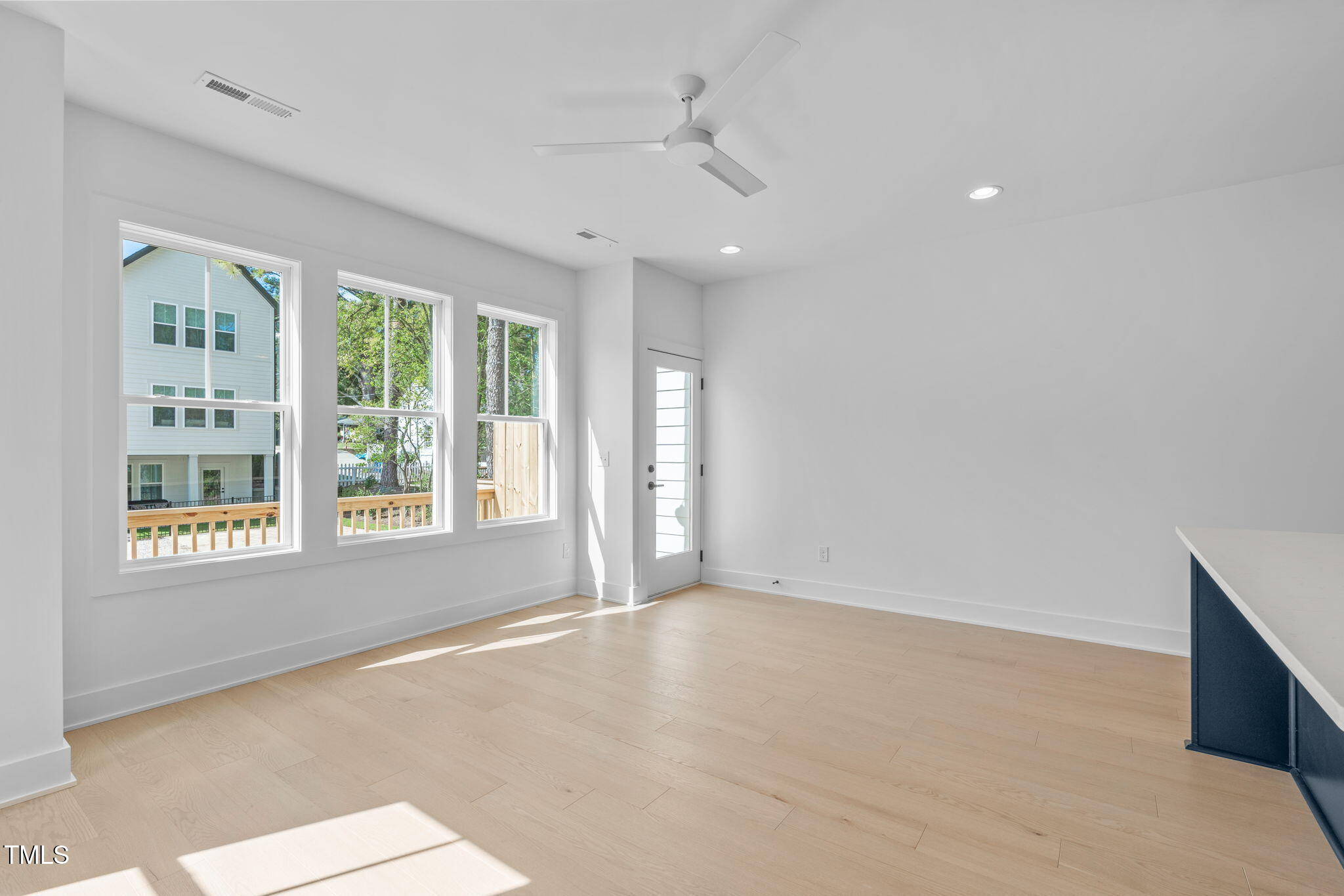 5049 Lundy Drive, Unit 102 Raleigh, NC 27606 - Photo 7 of 48 a view of an empty room with a window