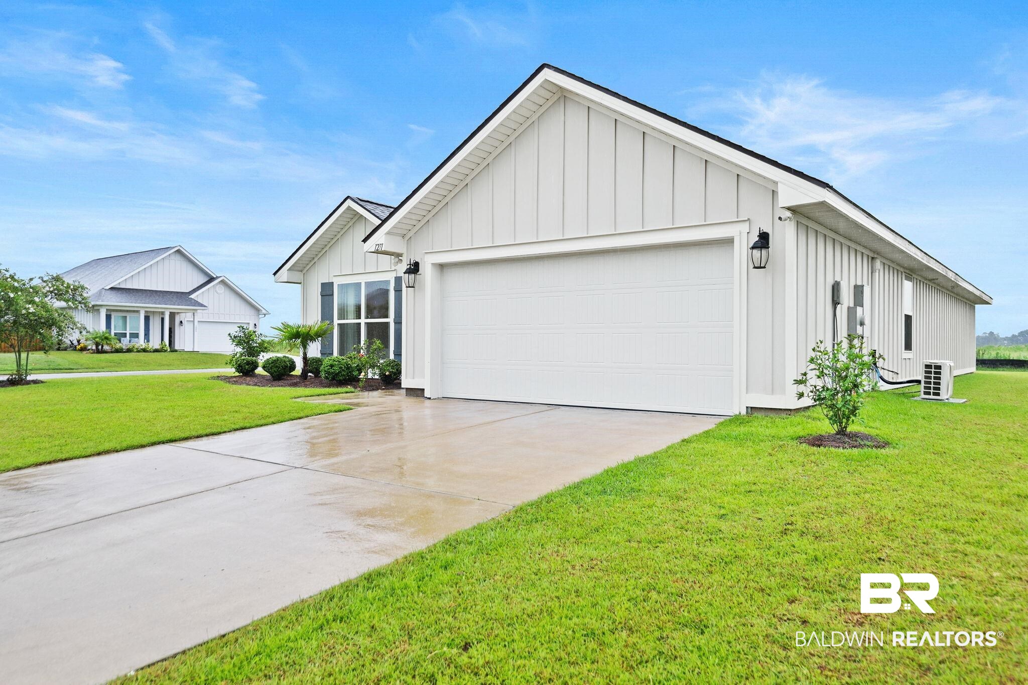 1271 Caper Avenue Foley, AL 36535 - Photo 2 of 29 View of front of house with a garage and a front lawn