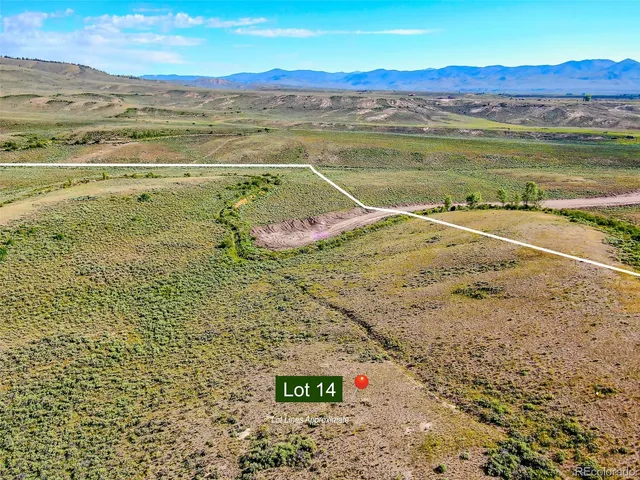 a view of an ocean and a mountain