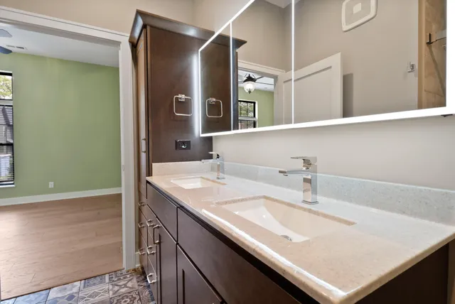 a bathroom with a sink and a mirror