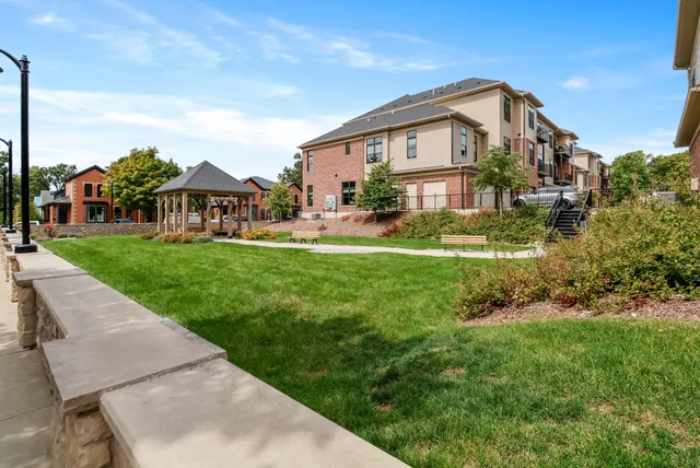 a street sign on a wall next to a building