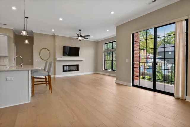 a view of livingroom with furniture fireplace and window