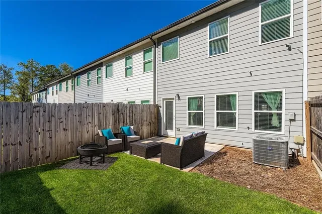 a backyard of a house with seating space