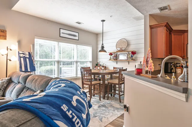 a view of a dining room with furniture window and outside view