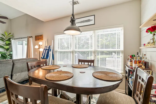 a view of a dining room with furniture window and outside view