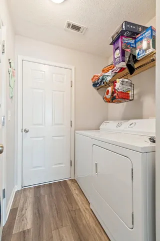 a utility room with dryer and washer