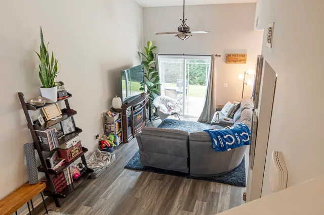 a living room with furniture and a window