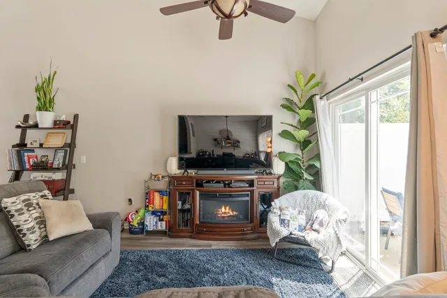 a living room with furniture and a fireplace