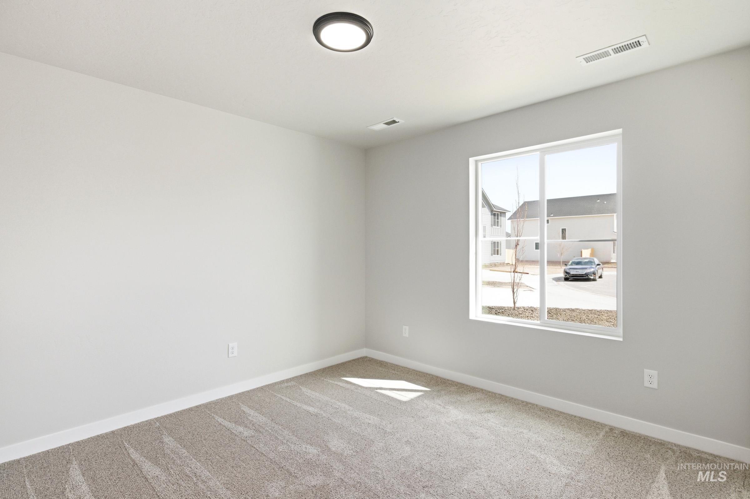 13734 Redway Court Caldwell, ID 83607 - Photo 11 of 20 Unfurnished room with light carpet and baseboards