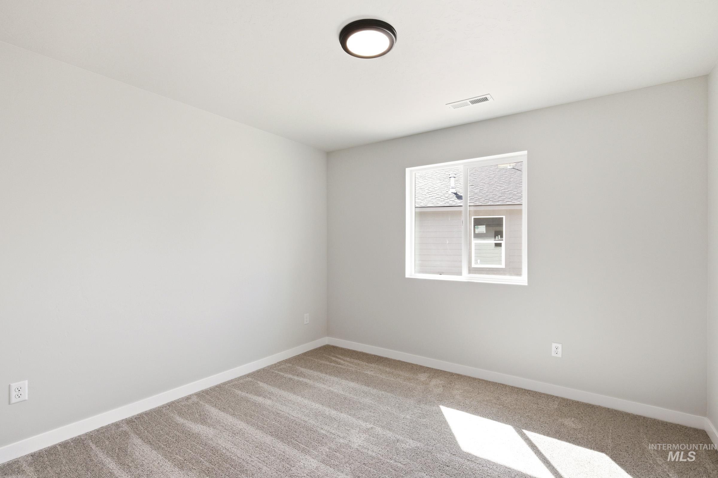 13734 Redway Court Caldwell, ID 83607 - Photo 15 of 20 Spare room with baseboards and light carpet