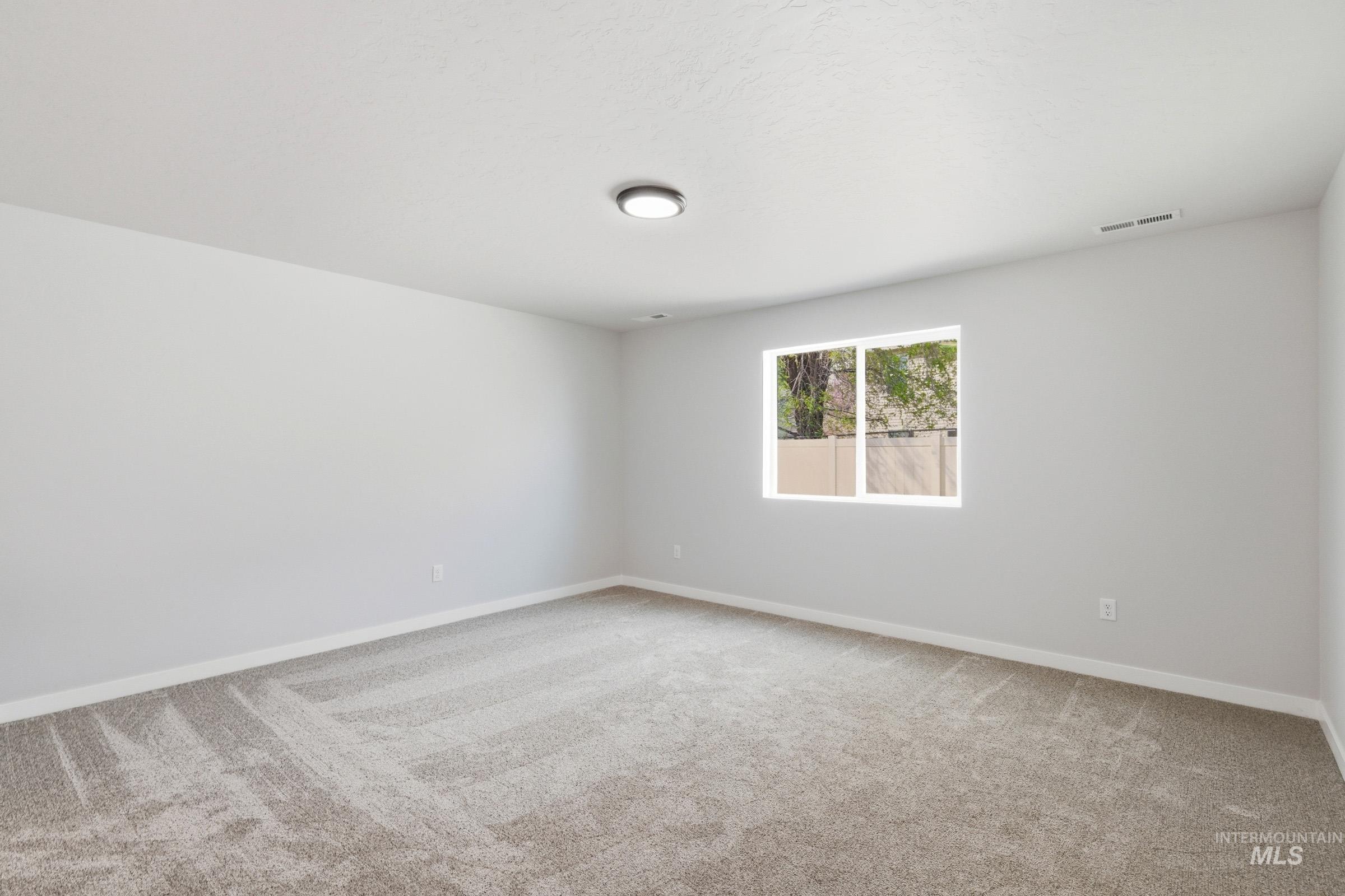 13734 Redway Court Caldwell, ID 83607 - Photo 16 of 20 Empty room featuring light carpet and baseboards