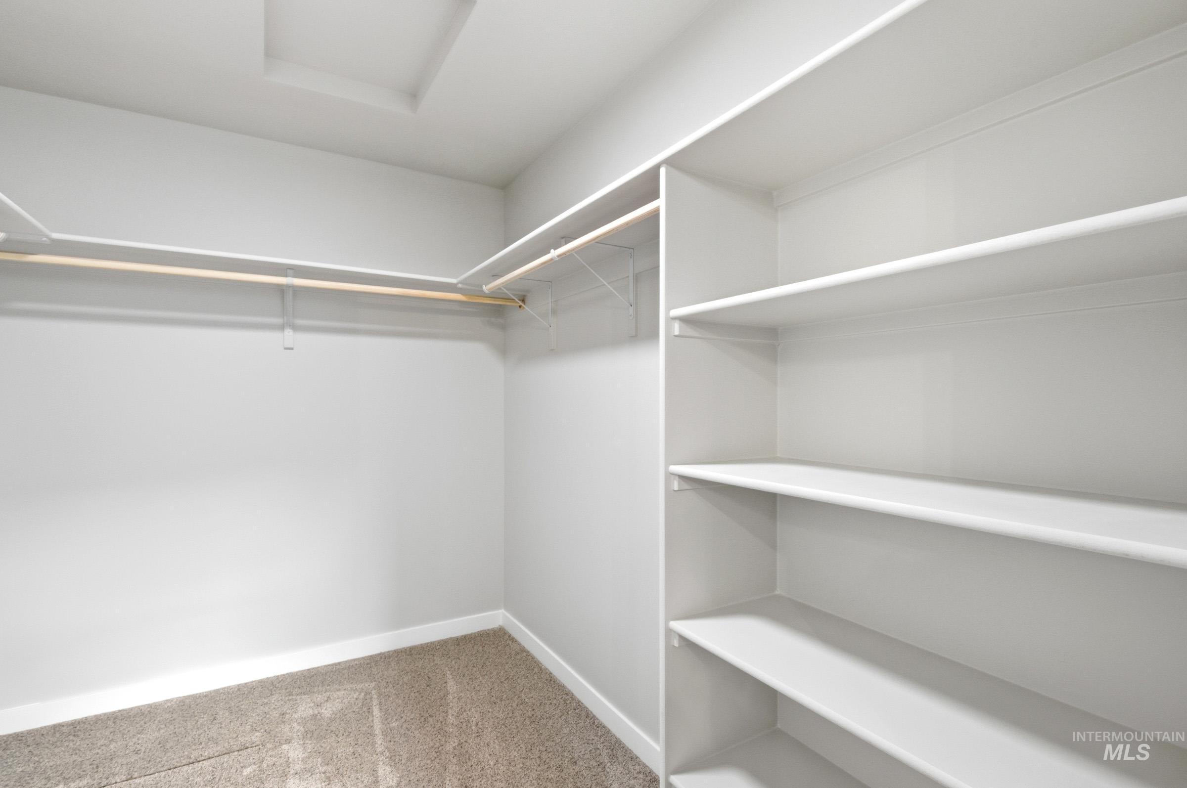 13734 Redway Court Caldwell, ID 83607 - Photo 18 of 20 Walk in closet with light carpet and attic access