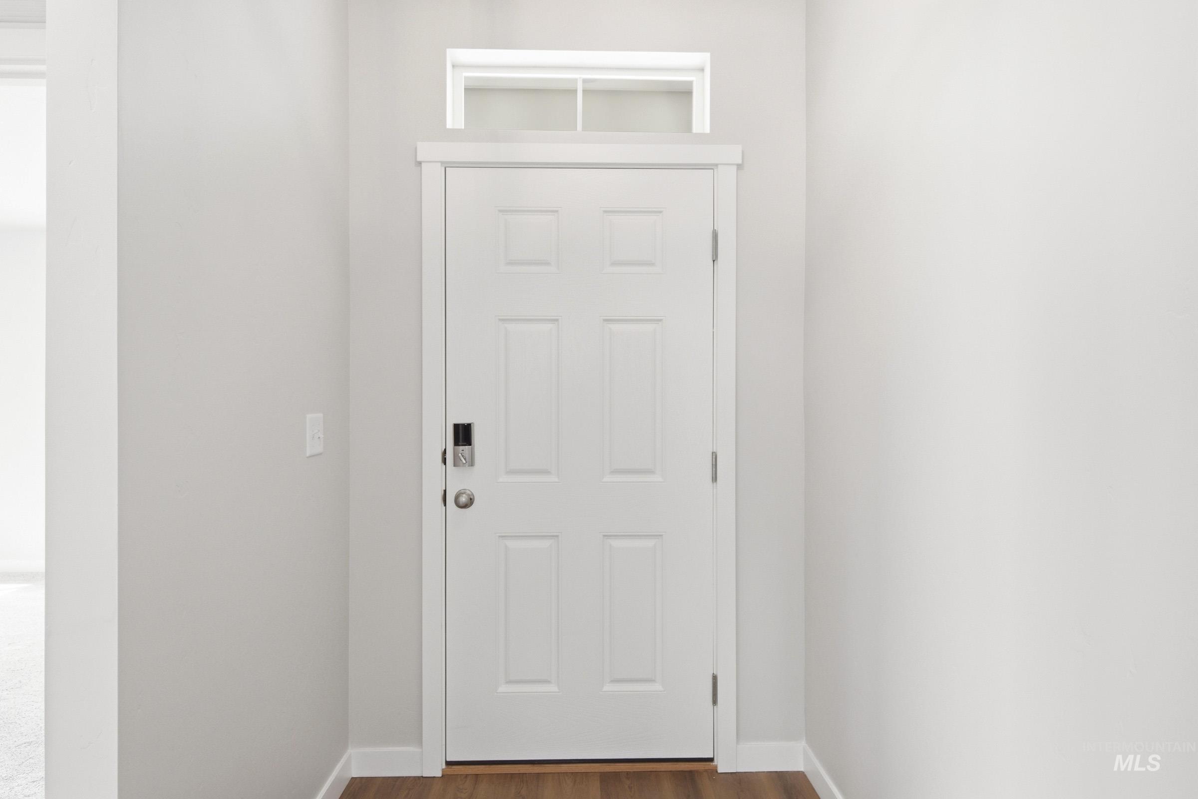 13734 Redway Court Caldwell, ID 83607 - Photo 2 of 20 Doorway to outside featuring wood finished floors and baseboards