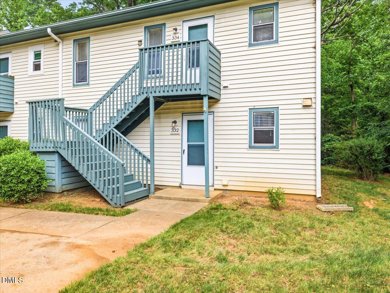 332 Ashley Forest Road Chapel Hill, NC 27514 - Photo 1 of 44 a front view of a house with a garden