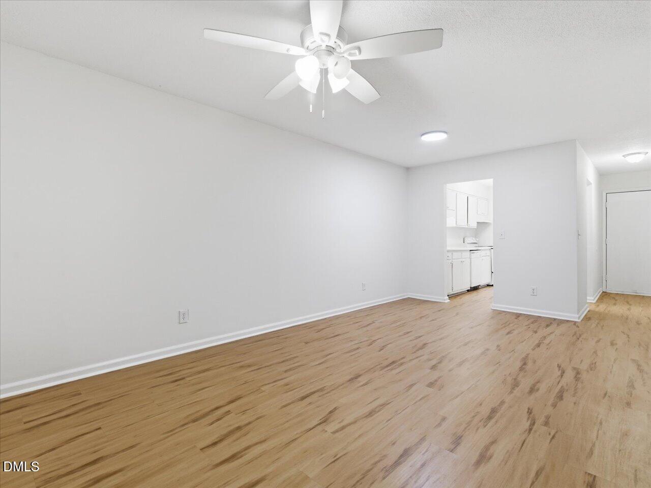 332 Ashley Forest Road Chapel Hill, NC 27514 - Photo 13 of 44 wooden floor in an empty room with a window