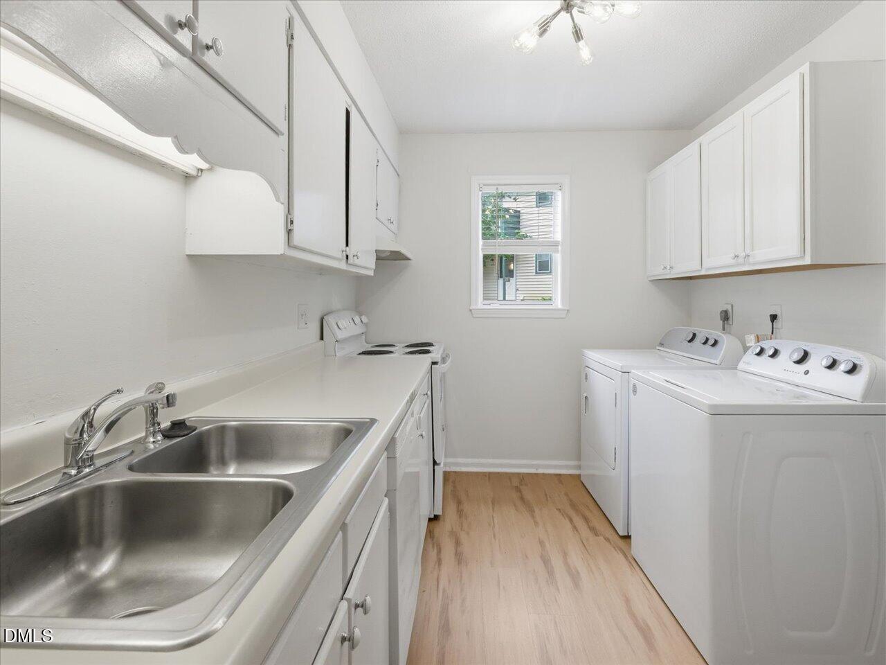 332 Ashley Forest Road Chapel Hill, NC 27514 - Photo 16 of 44 a utility room with a sink washer and dryer