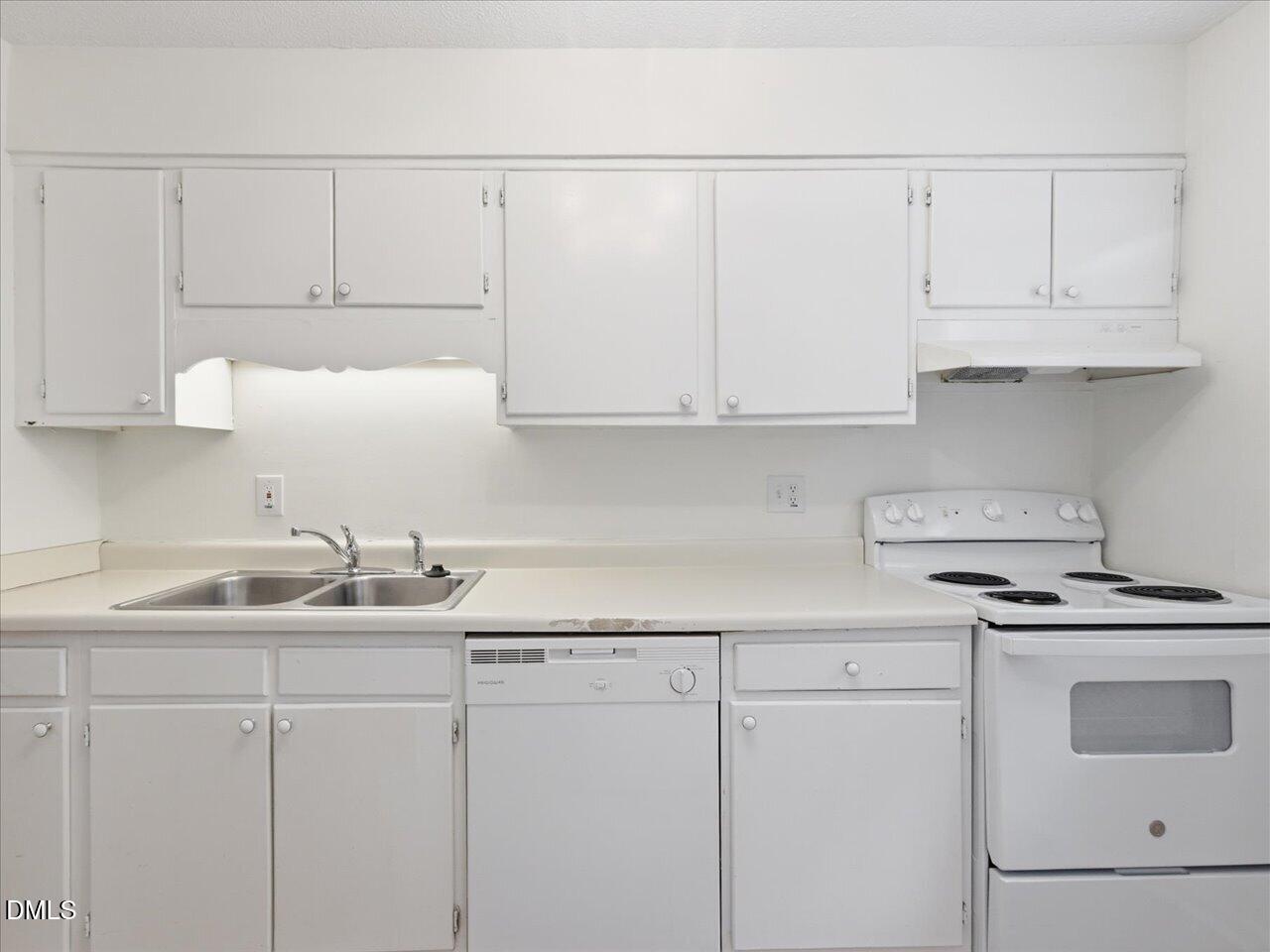 332 Ashley Forest Road Chapel Hill, NC 27514 - Photo 17 of 44 a kitchen with white cabinets and white appliances