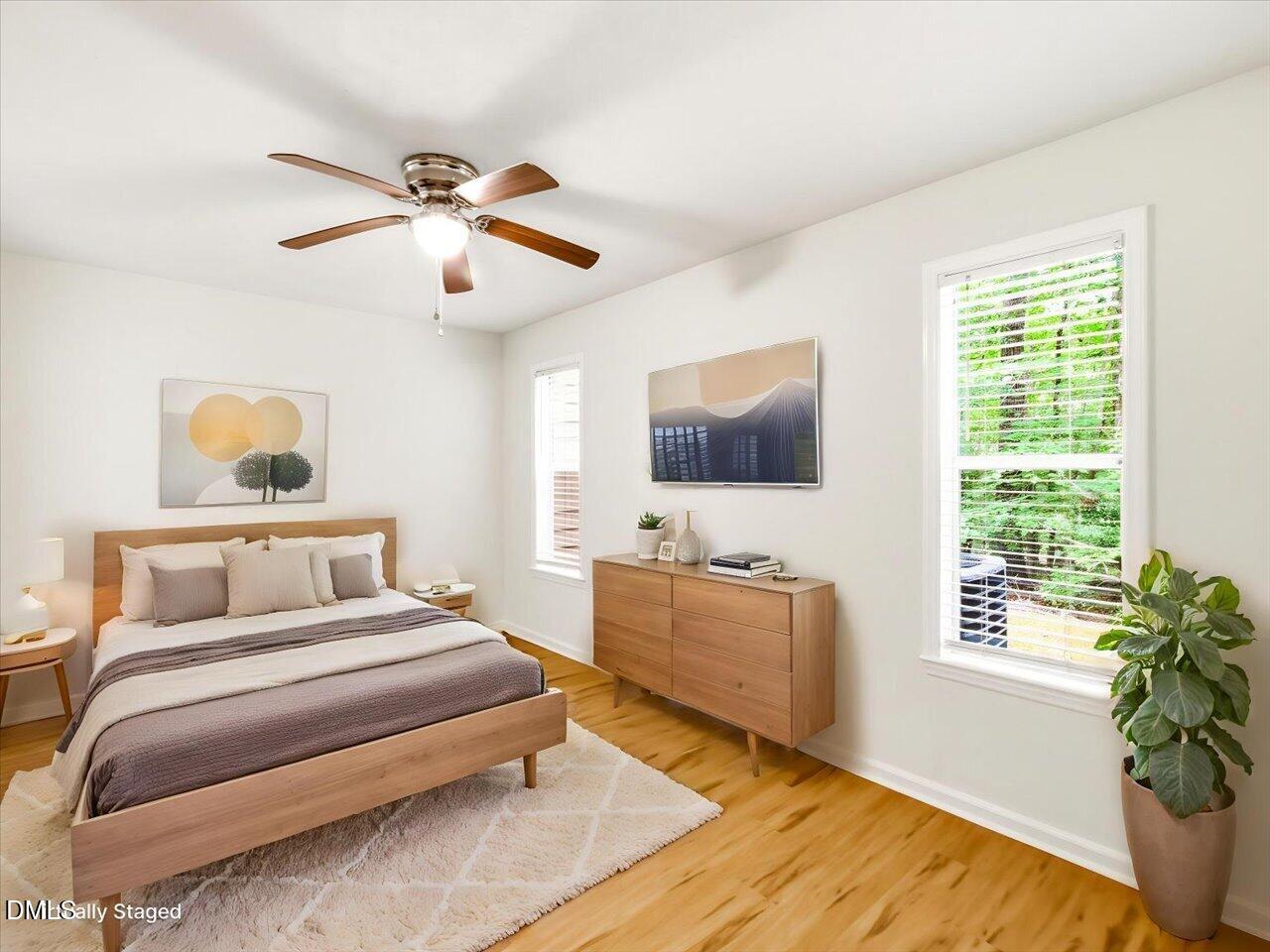 332 Ashley Forest Road Chapel Hill, NC 27514 - Photo 22 of 44 a bedroom with a bed and a flat screen tv